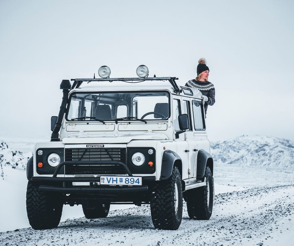 Picture of Jeannie Standing in the Back of a Defender Car | Iceland with a View