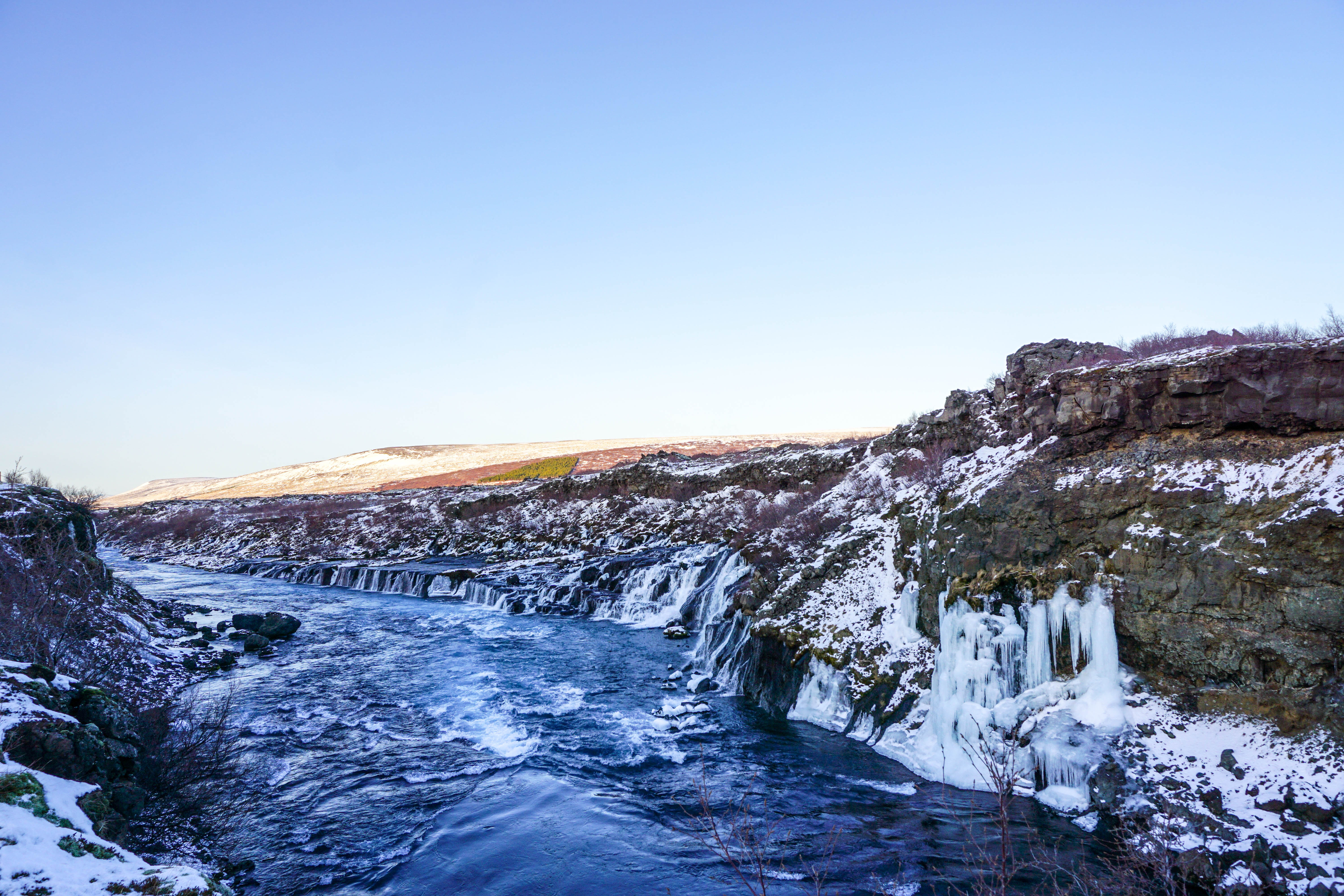 Looking for some Hidden Gems in Iceland? Get off the beaten path by visiting Hraunfossar & Barnafoss waterfalls, a quick day trip from Reykjavik! | Life With a View