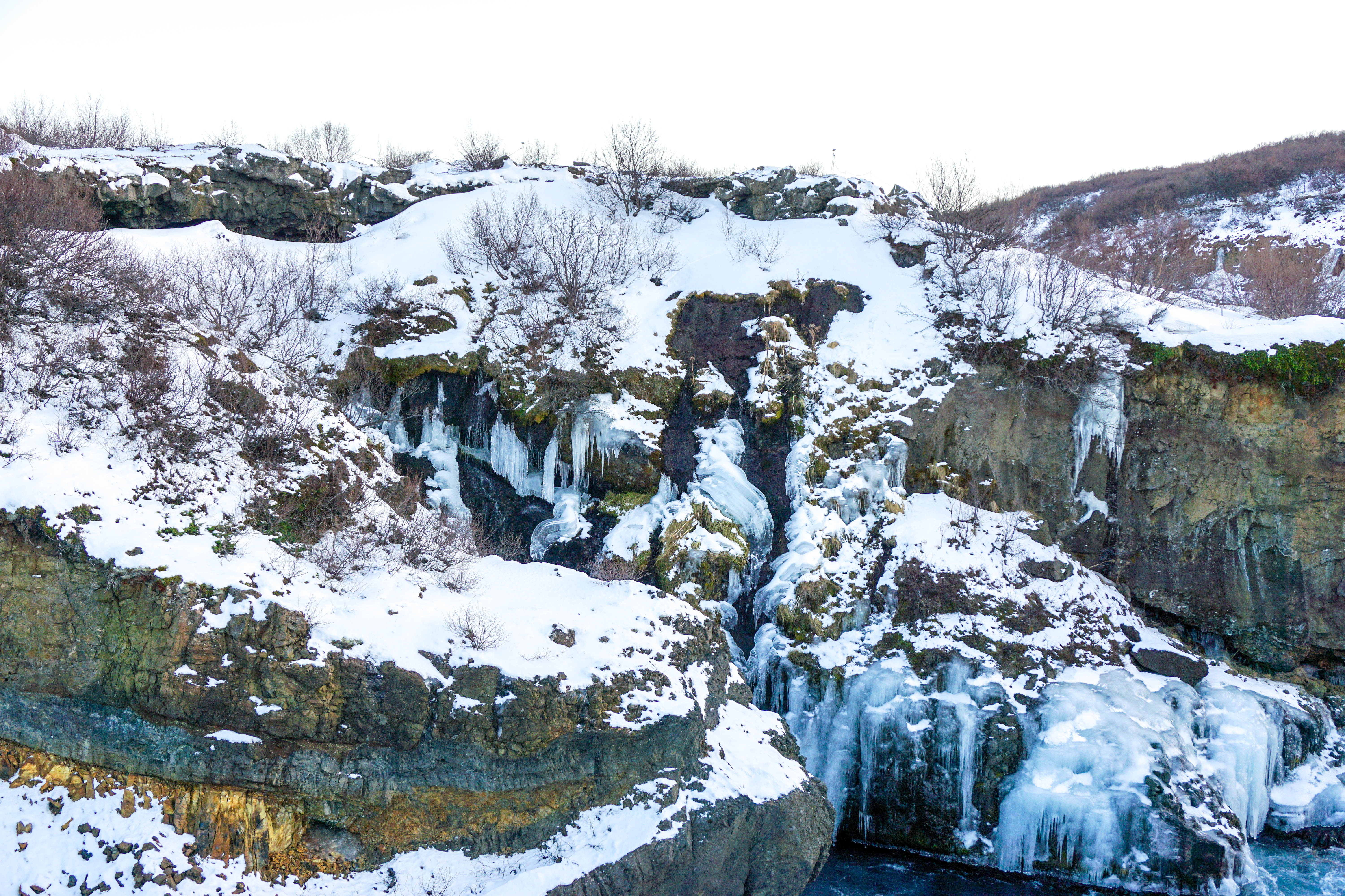 Looking for some Hidden Gems in Iceland? Get off the beaten path by visiting Hraunfossar & Barnafoss waterfalls, a quick day trip from Reykjavik! | Life With a View