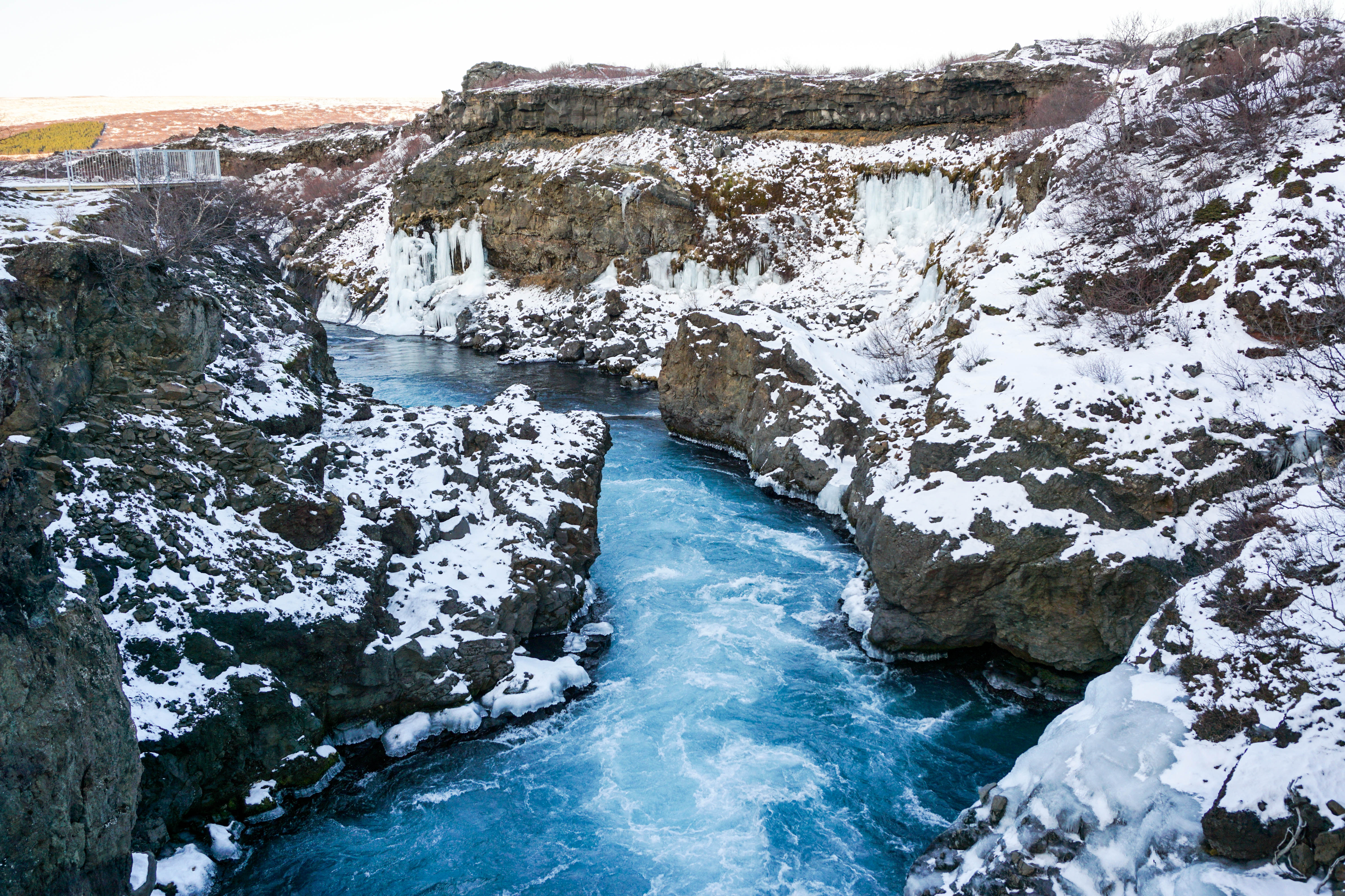 Looking for some Hidden Gems in Iceland? Get off the beaten path by visiting Hraunfossar & Barnafoss waterfalls, a quick day trip from Reykjavik! | Life With a View