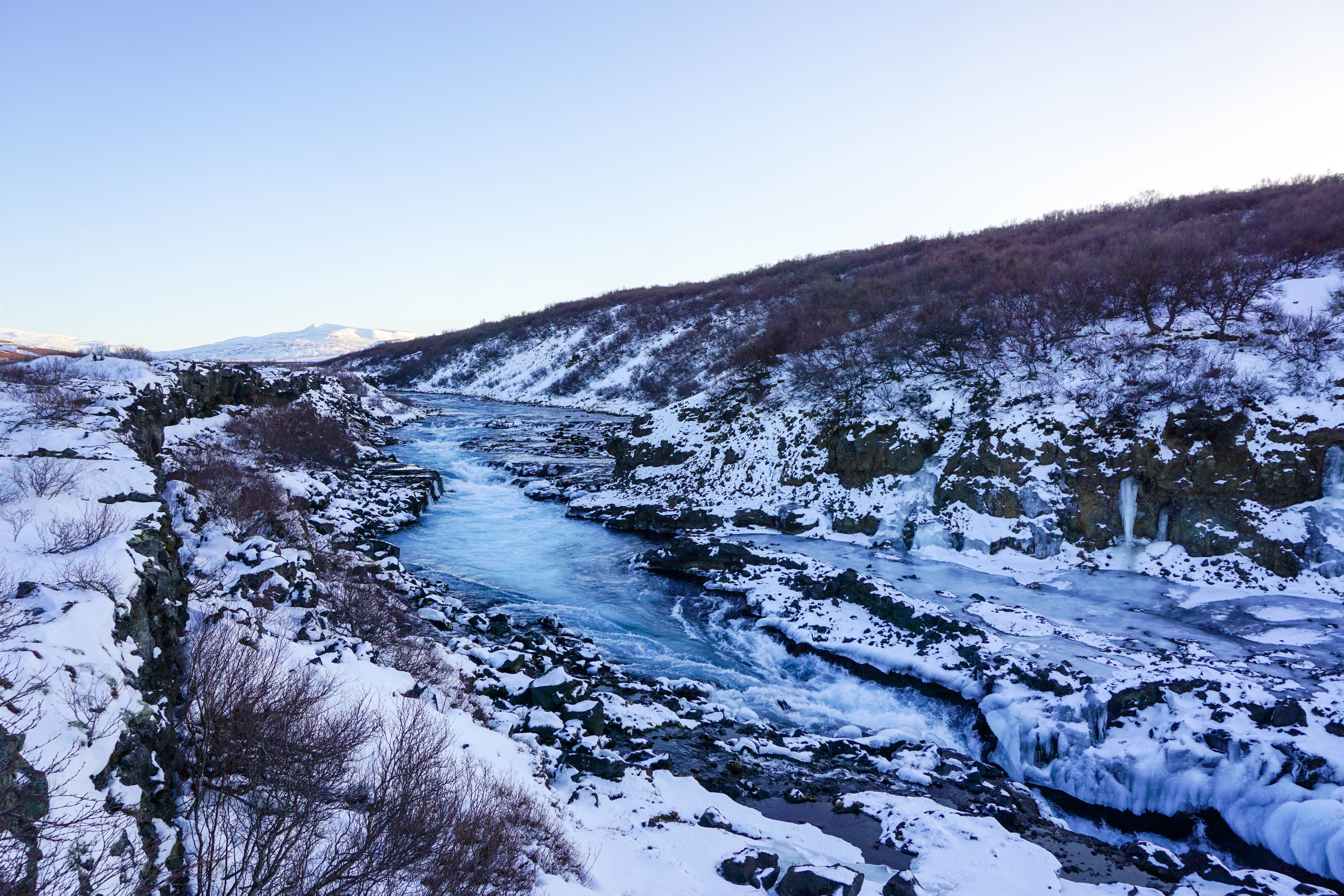 Looking for some Hidden Gems in Iceland? Get off the beaten path by visiting Hraunfossar & Barnafoss waterfalls, a quick day trip from Reykjavik! | Life With a View