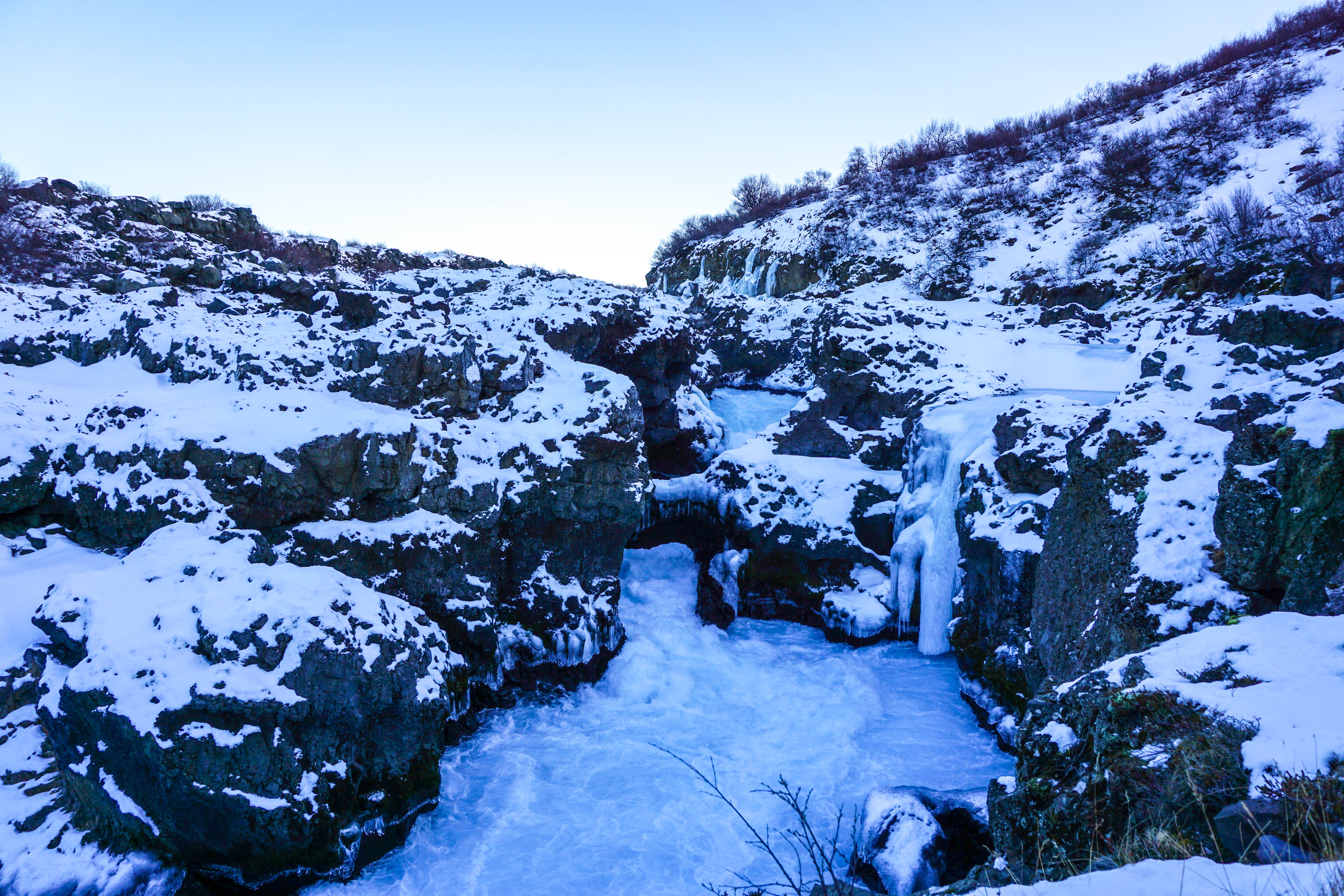 Looking for some Hidden Gems in Iceland? Get off the beaten path by visiting Hraunfossar & Barnafoss waterfalls, a quick day trip from Reykjavik! | Life With a View