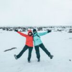 Picture of Jeannie and Bobby Smiling at the Camera Wearing Winter Clothes During Winter Season in Iceland | Iceland Winter Packing List | Iceland with a View