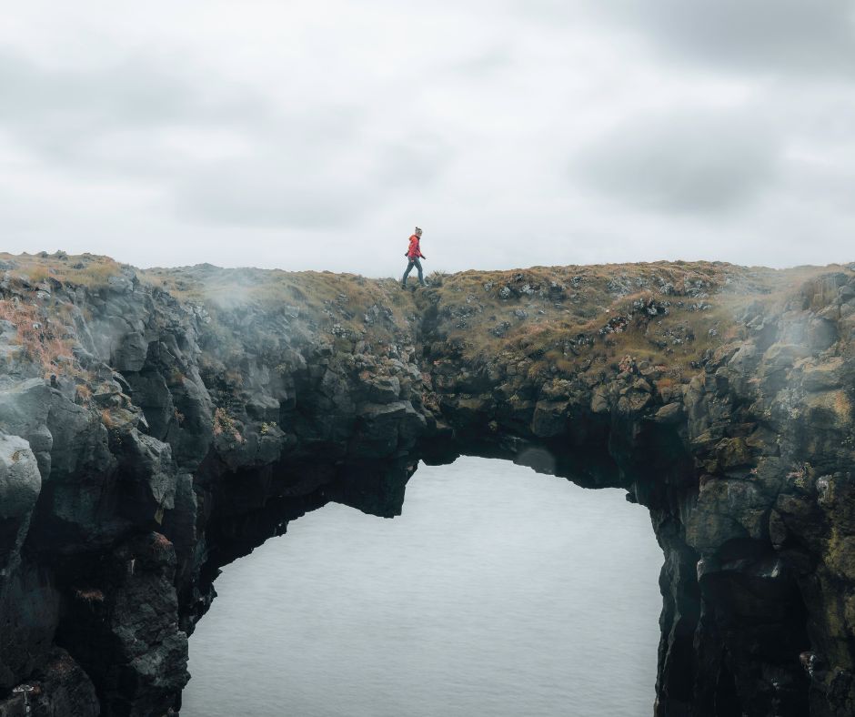 Picture of Jeannie Crossing the Snæfellsnes Rock Arch | Iceland with a View 