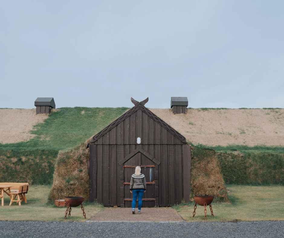 Picture of Jeannie Opening the Door at the Ingólfsskáli Viking Restaurant | Iceland with a View