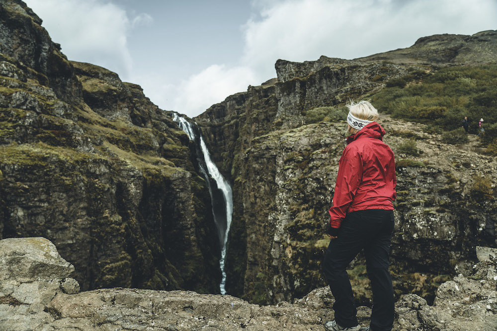 Picture of Jeannie Standing in Front of the Glymur Waterfall | Iceland with a View