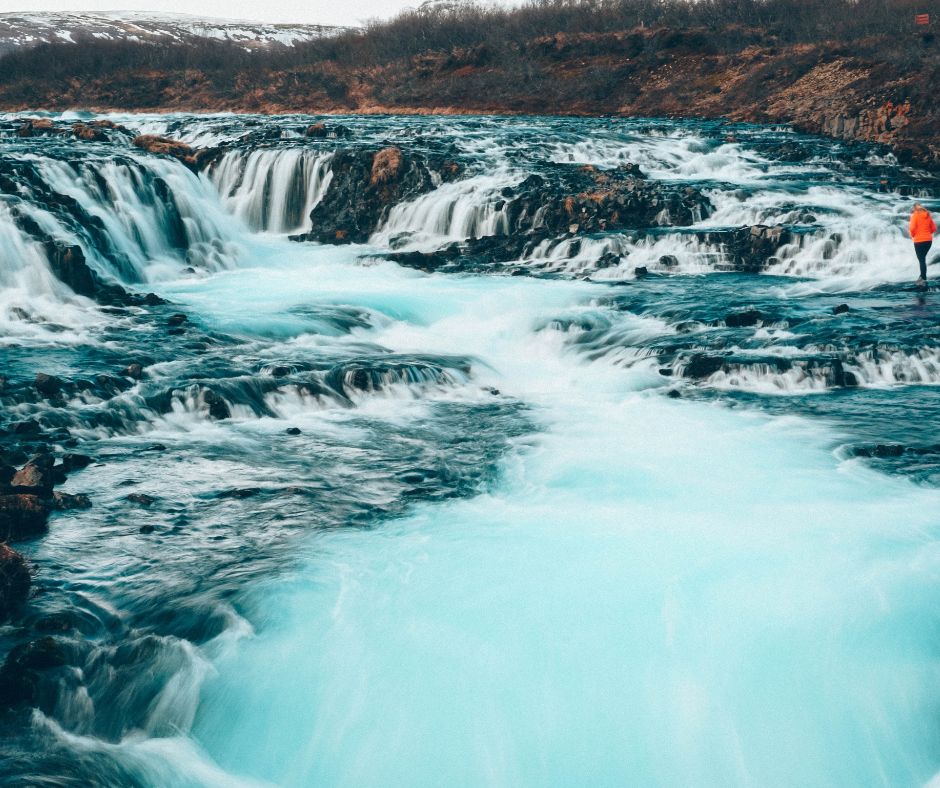 Picture of Jeannie Walking in Bruarfoss Waterfall | Iceland with a View