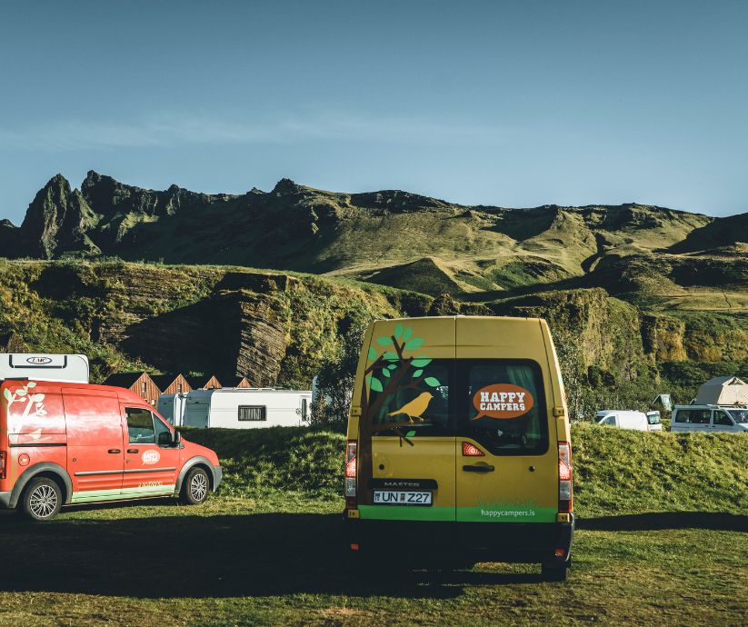 Picture of Two Happy Campers Van Parked In an Iceland Campsite | Iceland with a View 