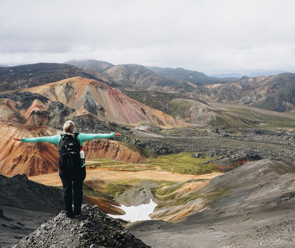 Picture of Jeannie with her Rain Gear Admiring the Landscape View of Iceland's Highlands | Iceland with a View 