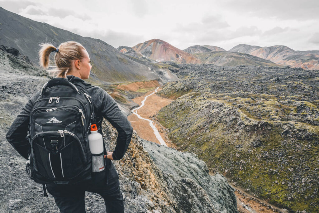Jeannie hiking on Iceland with a bottle of water on her backpack | Iceland with a View 