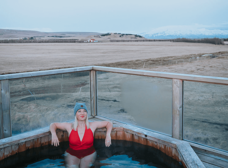 Things To Do In Iceland In July | Picture of Jeannie Soaking In A Hot Spring