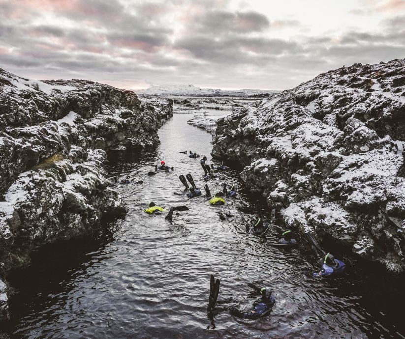 Picture of People Snorkeling in Silfra,  One of the Things You can Do in August in Iceland | Iceland with a View 