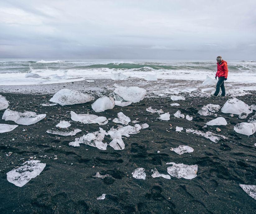 Jeannie walking on Diamond Beach or Crystal Beach in Iceland | South Coast Iceland | Iceland with a View 