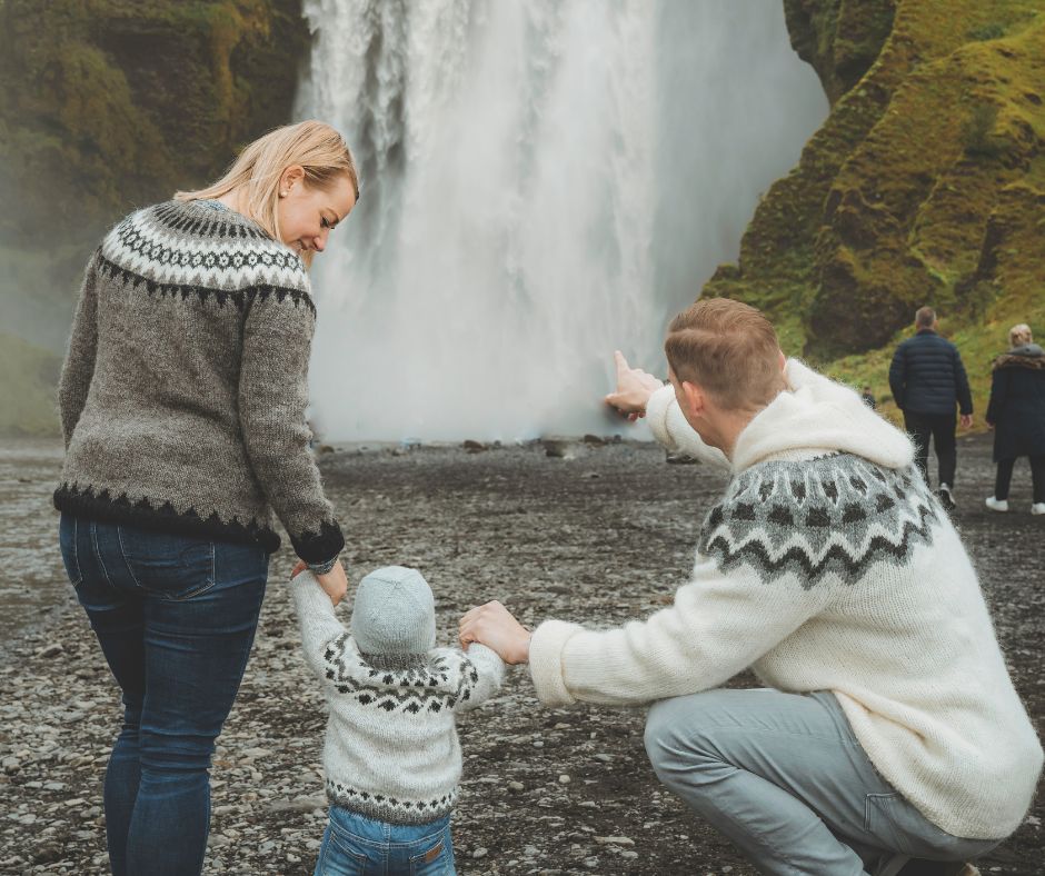 Jeannie and her Husband Showing their Kid the Skógafoss Waterfall in Iceland | Iceland Family Holiday | Iceland with a View 