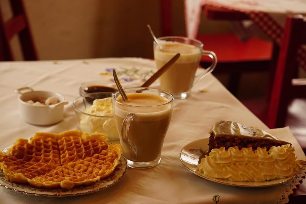 Picture of Coffee Table with Coffee, Waffles, and Pastries on a Coffee Shop in Reykjavík | Reykjavík Restaurant Food Guide | Iceland with a View 