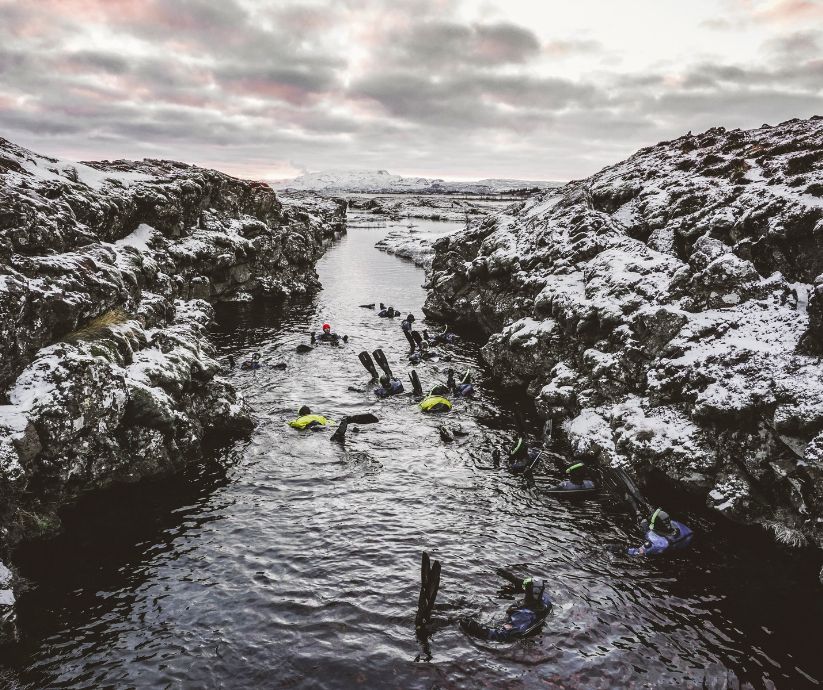 Picture of People Snorkeling in Silfra in Iceland | Iceland with a View 