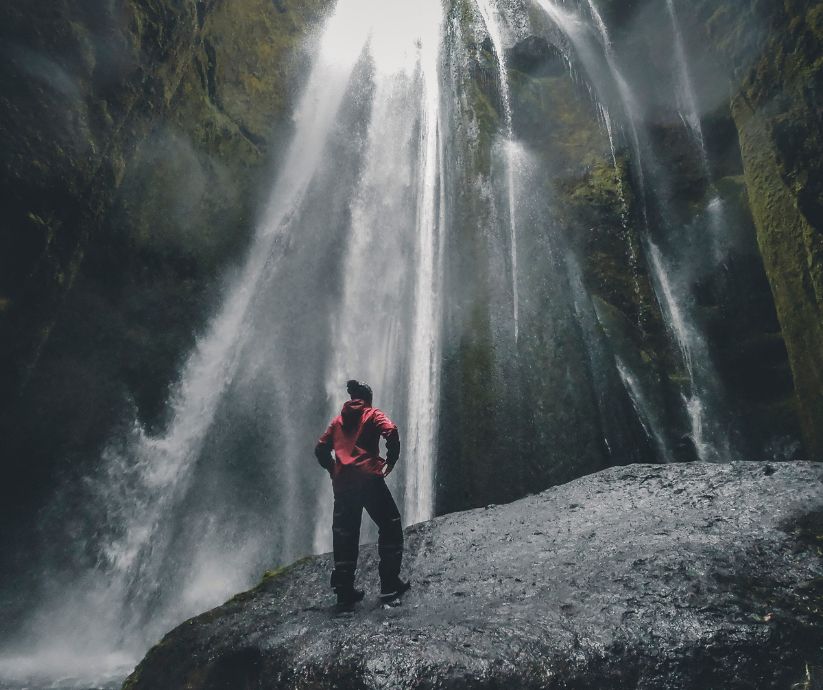Picture of Jeannie in Front of the Gljúfrabúi Iceland Waterfall | Iceland with a View