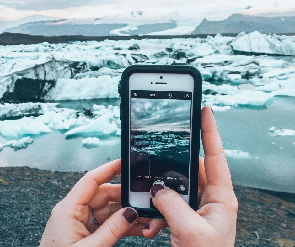 Picture of Jeannie taking a picture Iceland Winter View at the Diamond Beach in Iceland | Iceland Winter Packing List | Iceland with a View 