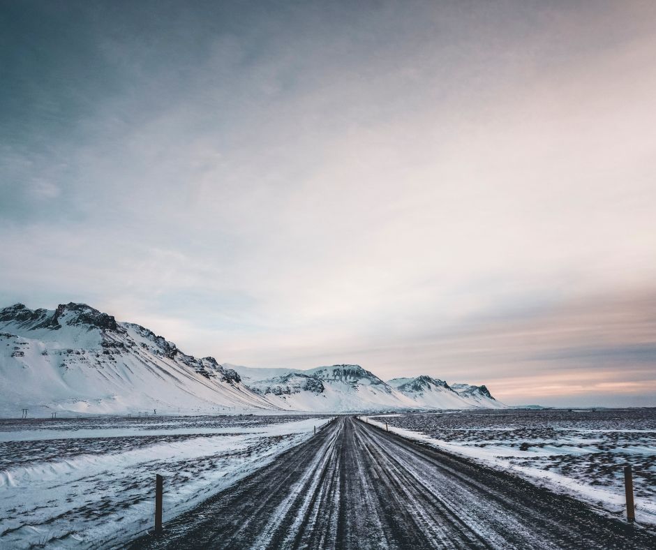 Picture of a Winter Sunset in Iceland Viewed from the Clear Road Covered in Snow | Iceland with a View