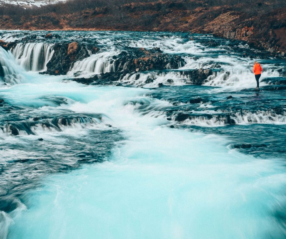 Picture of Jeannie Walking on Bruarfoss Waterfall | Iceland with a View 