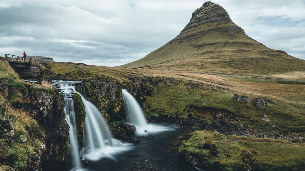 Picture of Jeannie Standing in the Trail that lets you See the Kirkjufell Mountain and Falls in the Snæfellsnes Peninsula | Iceland with a View 