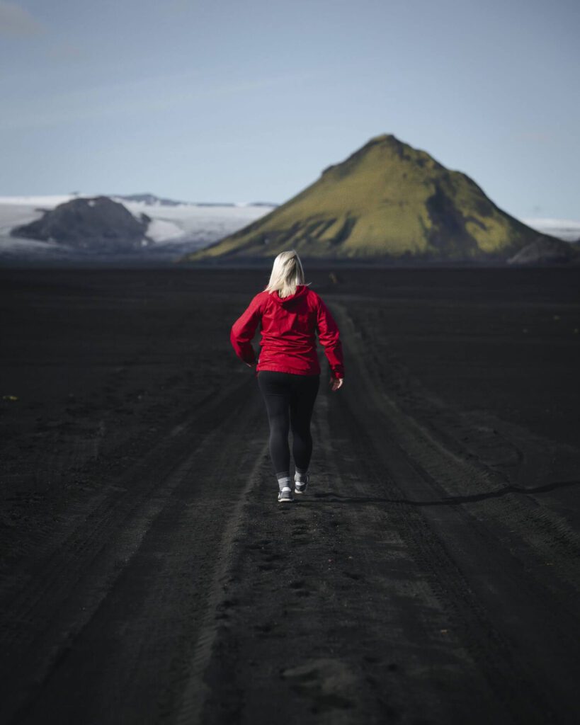 Picture of Jeannie Walking Towards the Road to the Highlands | Best Iceland Travel Guide | Iceland with a View