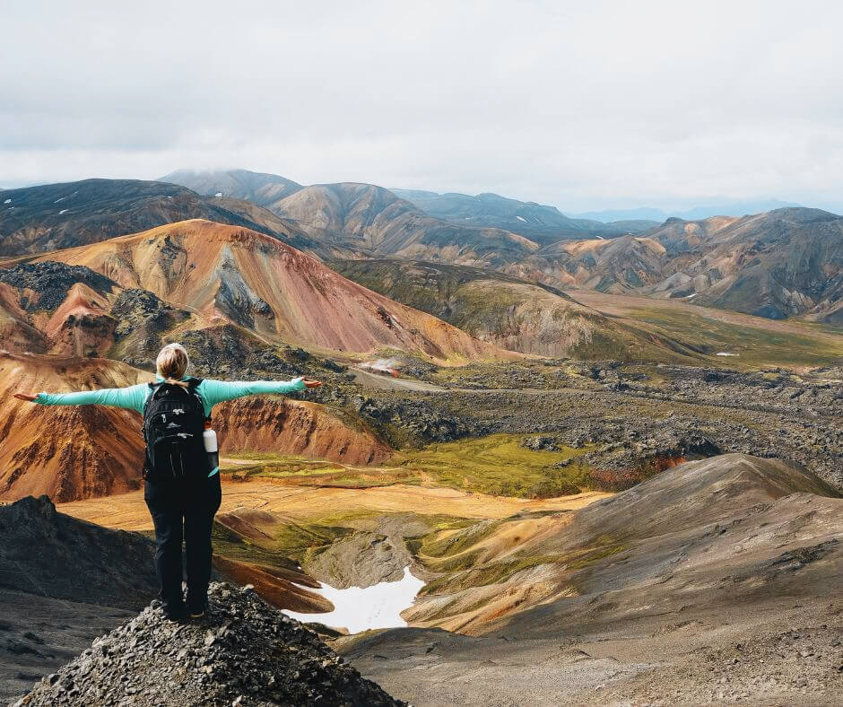 Picture of Jeannie at the Top of the Mountain in  Landmannalaugar, Iceland | Iceland with a View 