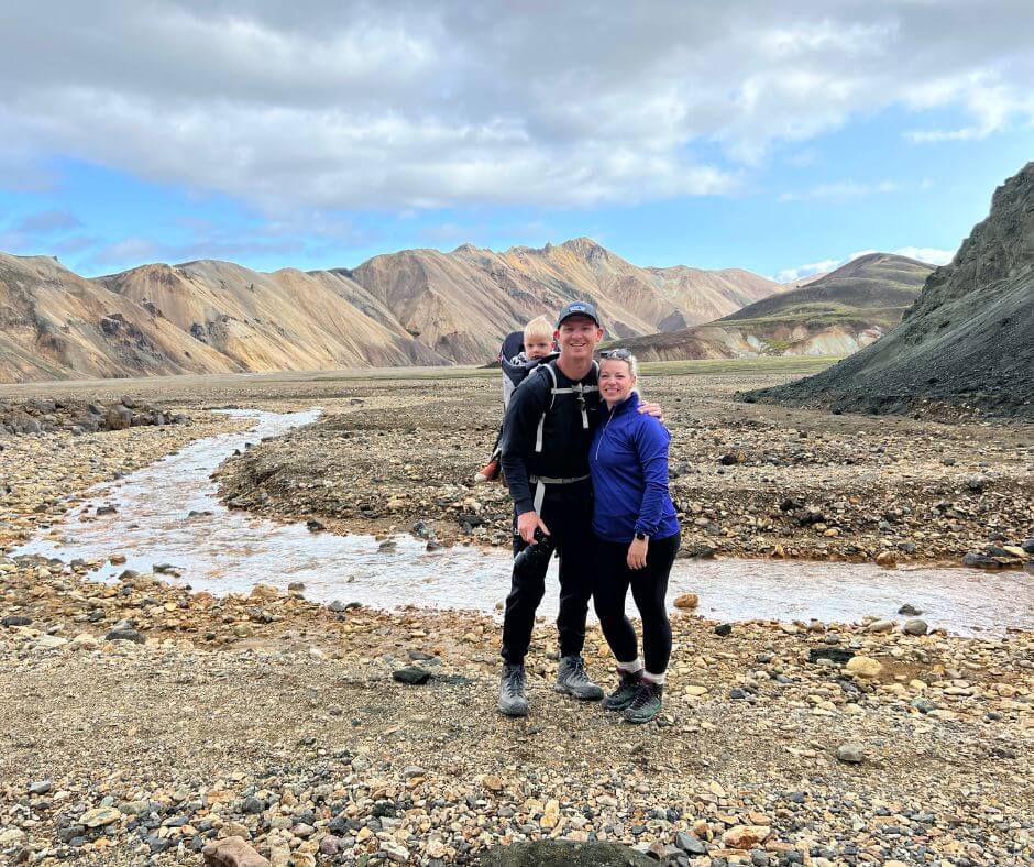 Picture of Jeannie with her Husband and Toddler Wearing Layers and Posing for the Camera in the Highlands in Iceland, an Activity you can do in April in Iceland | Iceland with a View