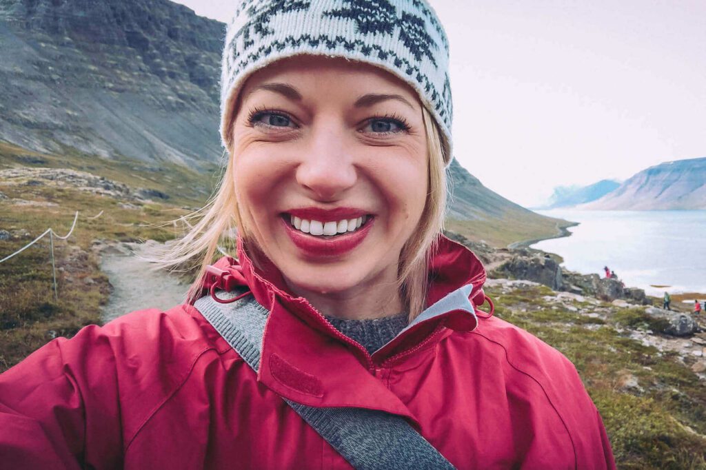 Picture of Jeannie Smiling at the Camera in the Westjfords in Iceland. Jeannie is Your Go-To for Iceland Travel Guides | Iceland with a View  
