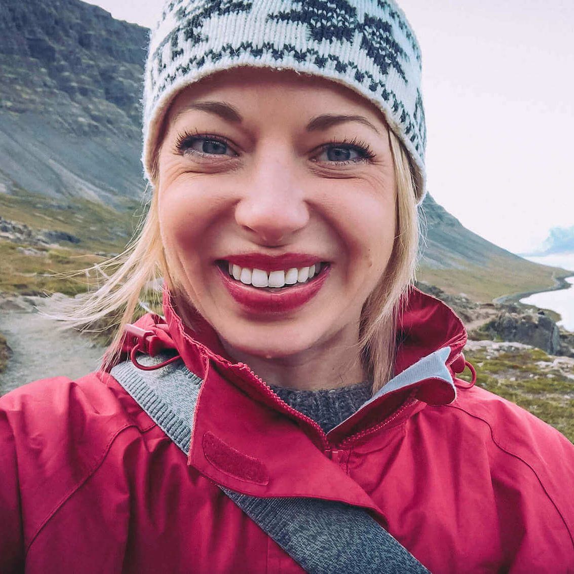 Picture of Jeannie Smiling at the Camera in the Westjfords in Iceland. Jeannie is Your Go-To for Iceland Travel Guide | Iceland with a View