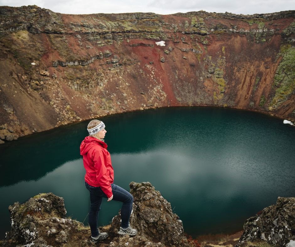 Picture of Jeannie in Kerid Wearing a Headband, Rain Coat and Hiking Boots as Par of Her Iceland Summer Packing List | Iceland with a View 