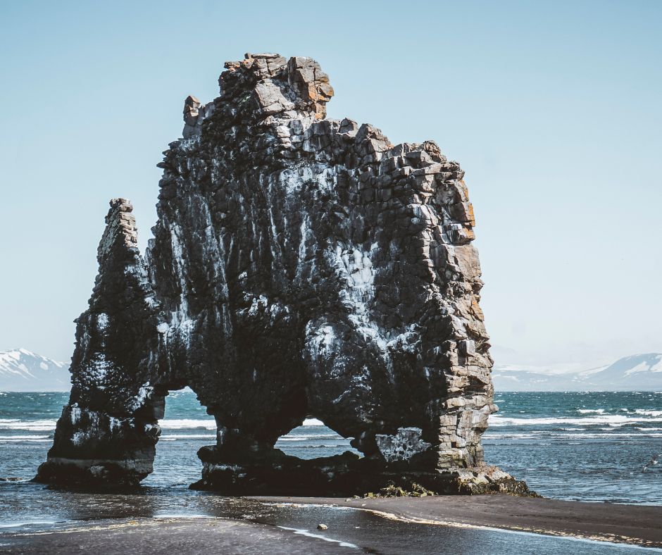 Picture of Hvítserkur, also known as the "white shirt" rock standing at a height of 49ft (15m) in the ocean in North Iceland | Iceland with a View 