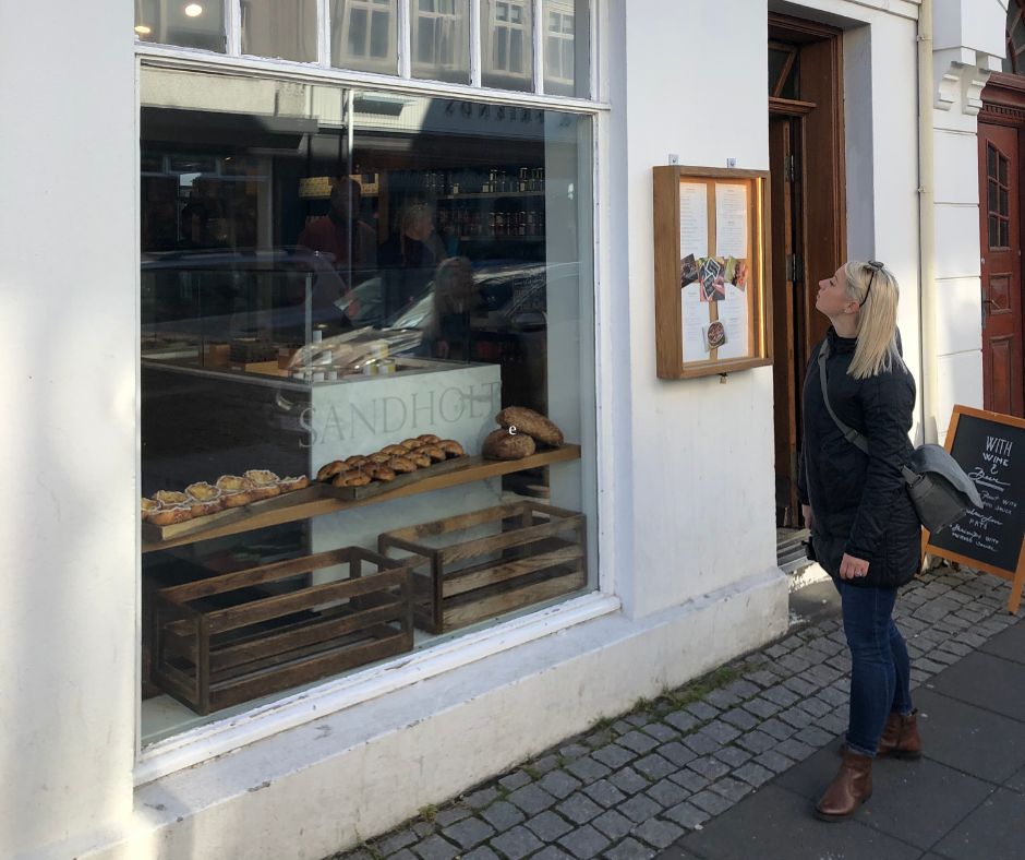 Picture of Jeannie Standing in Front Sandholt Looking at the Breakfast in Iceland | Iceland with a View 