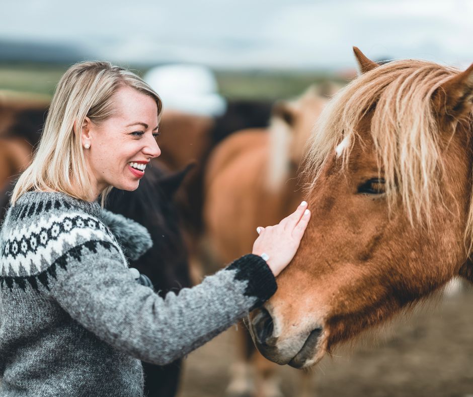 Picture of Jeannie Caressing an Icelandic Horse | Fun Facts About Iceland | Iceland with a View 