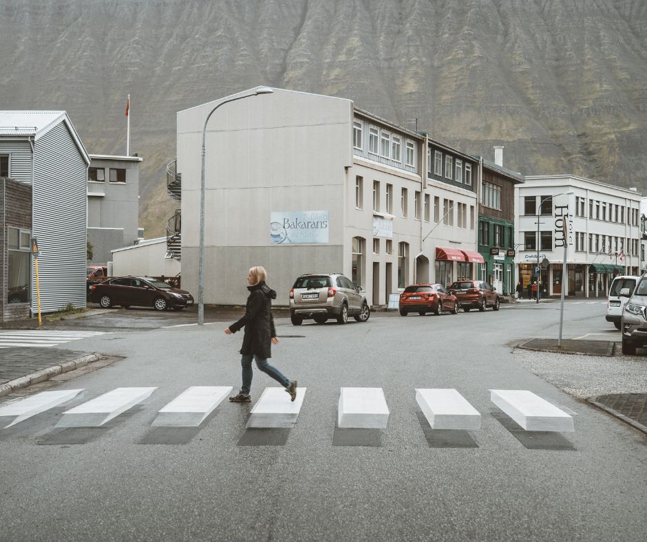 Picture of Jeannie Walking in a 3-D Crosswalk in Reykjavík, Iceland as part of Staying Cozy and on the Area when there's an Iceland Travel Warning | Iceland with a View 