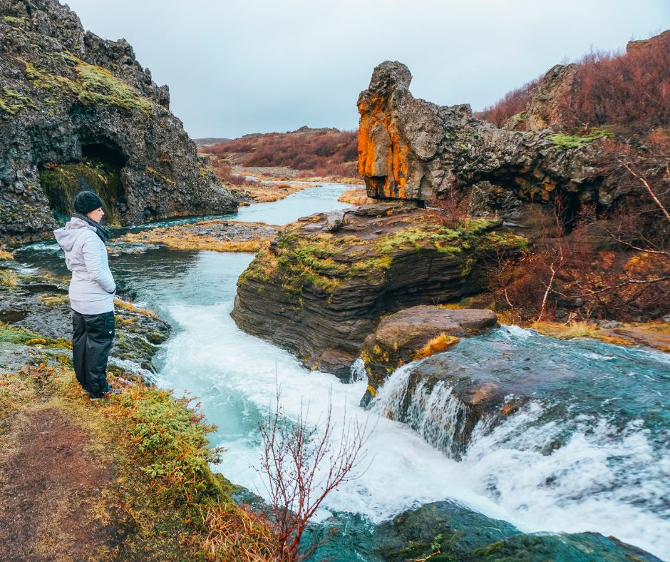 Picture of Jeannie Admiring the Breathtaking View of a Waterfall in Iceland in Fall | Iceland with a View