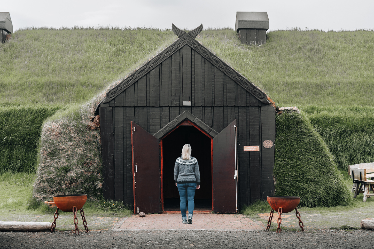 Picture of Jeannie Opening the Door at the Ingólfsskáli Viking Restaurant | Iceland with a View