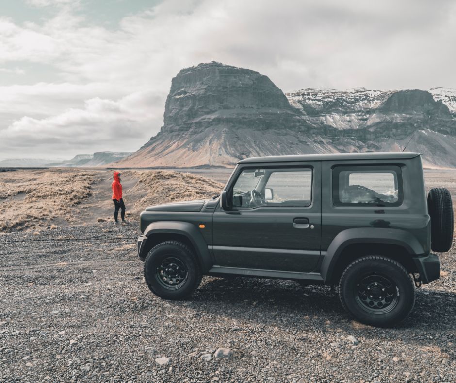 Picture Of Jeannie Walking alongside Her Rental car In Iceland | Iceland with a View 
