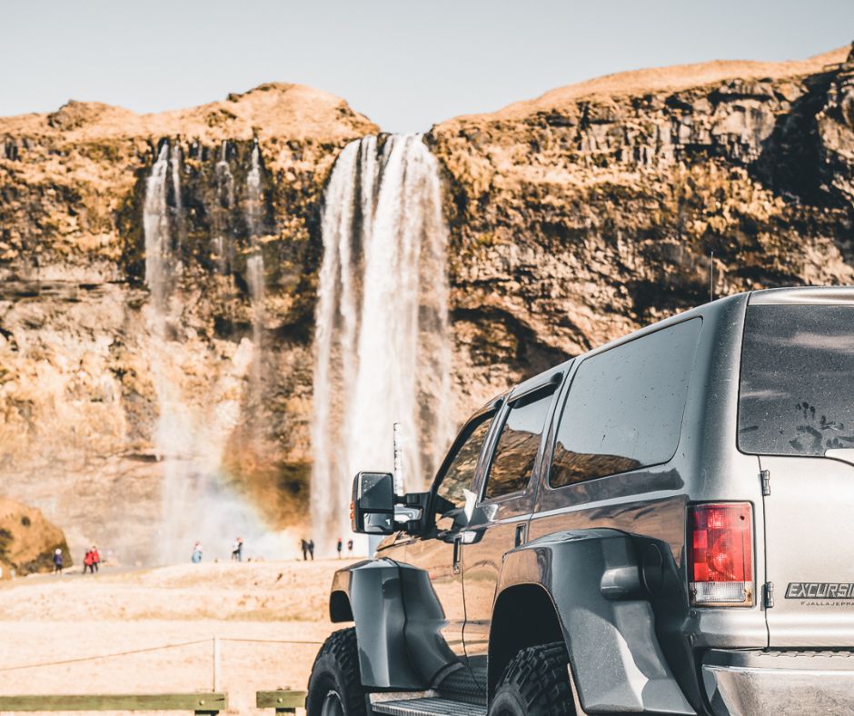 Picture of a 4WD car Parked in Front of the Skogafoss Waterfall in Iceland | Iceland with a View 