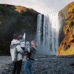 Picture of Jeannie and Her Husband Showing Skógafoss to their Children | Iceland with a View