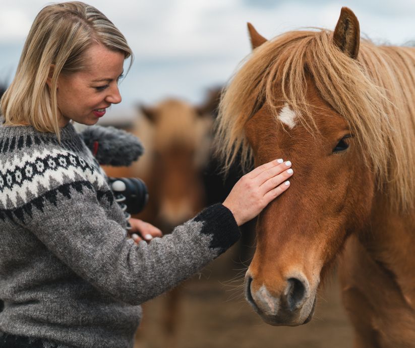 Picture of Jeannie and an Icelandic Horse in Hestaland in the South Coast of Iceland | Iceland with a View