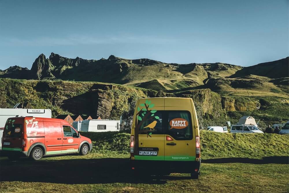 Landscape View of a Campsite with Two Happy Campervans Parked | Iceland with aView 