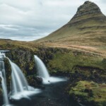 Picture of Jeannie Standing in the trail that lets you see the Kirkjufell Mountain and Falls in the Snæfellsnes Peninsula | Iceland with a View